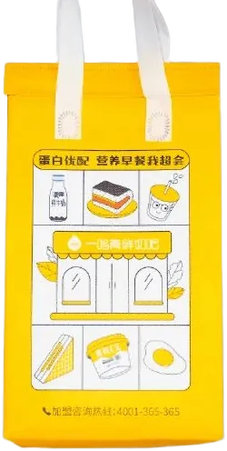 Yellow box-shaped food delivery bag illustrated with breakfast drinks and a shopfront