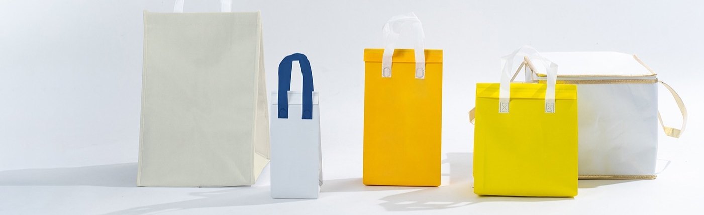 Insulated cooler bags in several sizes, from a small bottle carrier to a large box-shaped bag